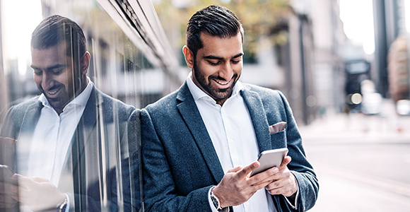A man looking at his smart phone