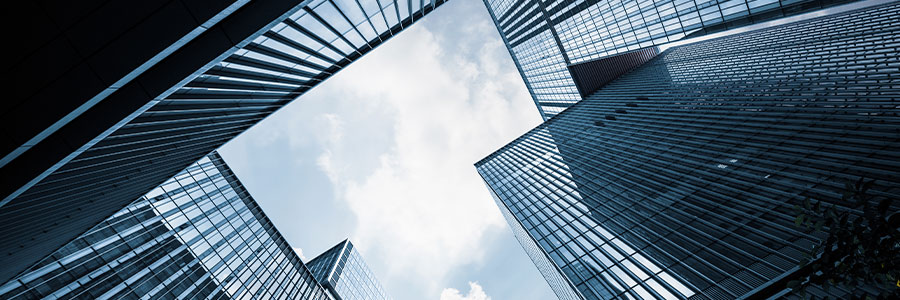 Looking upwards at tall office buildings.